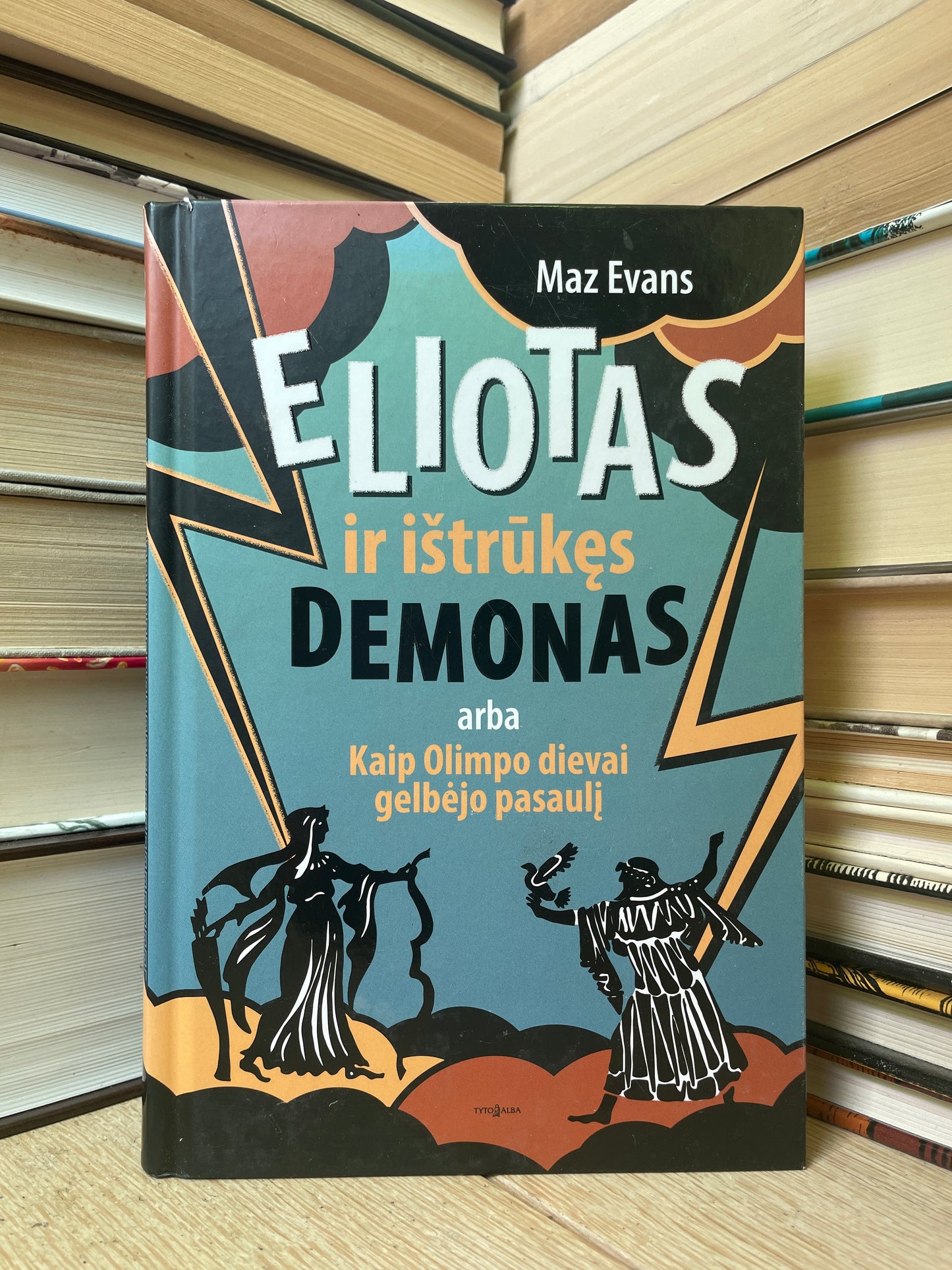 Maz Evans - ,,Eliotas ir ištūkęs demonas arba Kaip Olimpo dievai gelbėjo pasaulį"